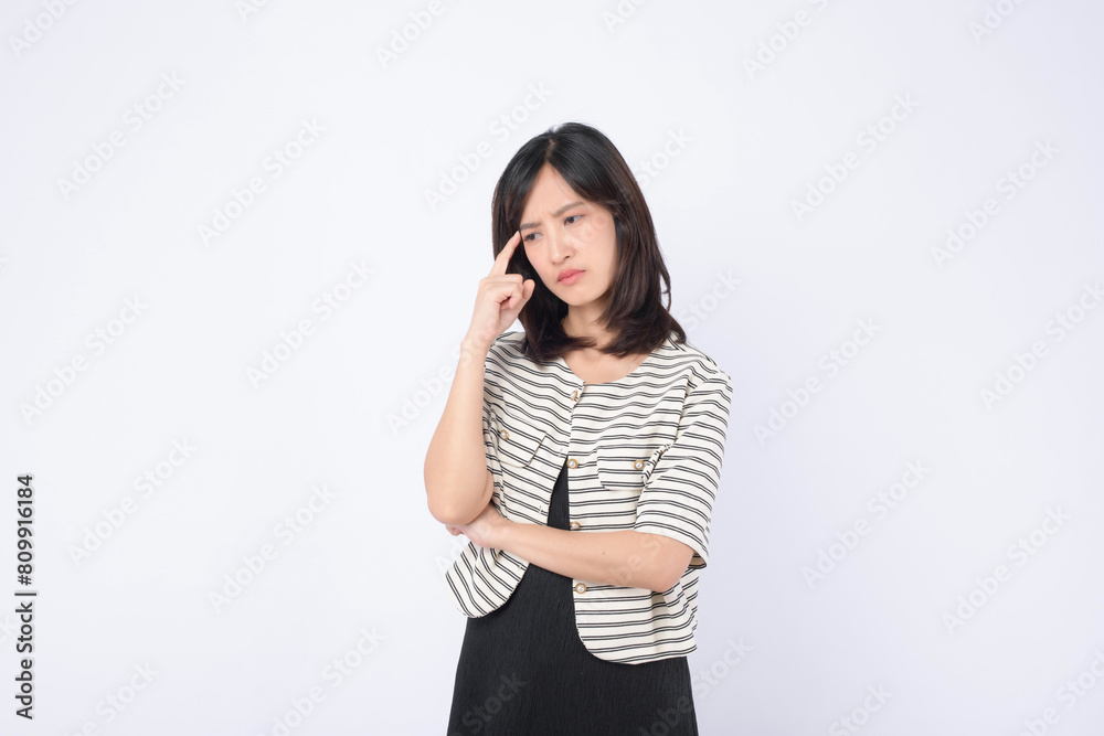 Asian woman with thinking pose against a white background. Asian woman with thinking pose against a white background.