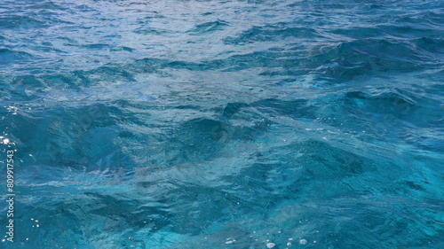 Pristine crystal clear turquoise blue sea water of th Caribbean Atlantic ocean flowing with waves 