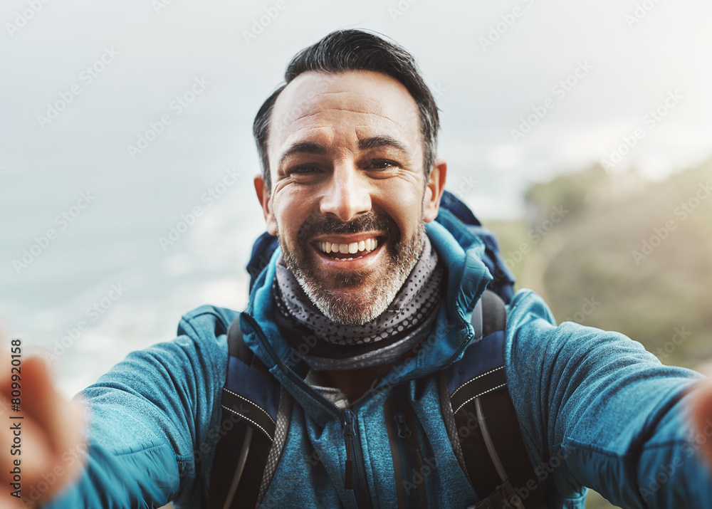 Selfie, hike and man with nature, fitness and adventure with exercise, training and challenge. Portrait, person and hiker with smile, environment and influencer with profile picture, joy and journey