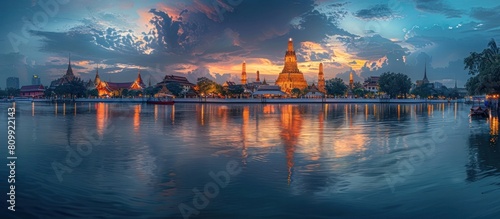 Majestic Riverside Reverence Illuminating the Timeless Splendor of Wat Chaiwatthanaram photo
