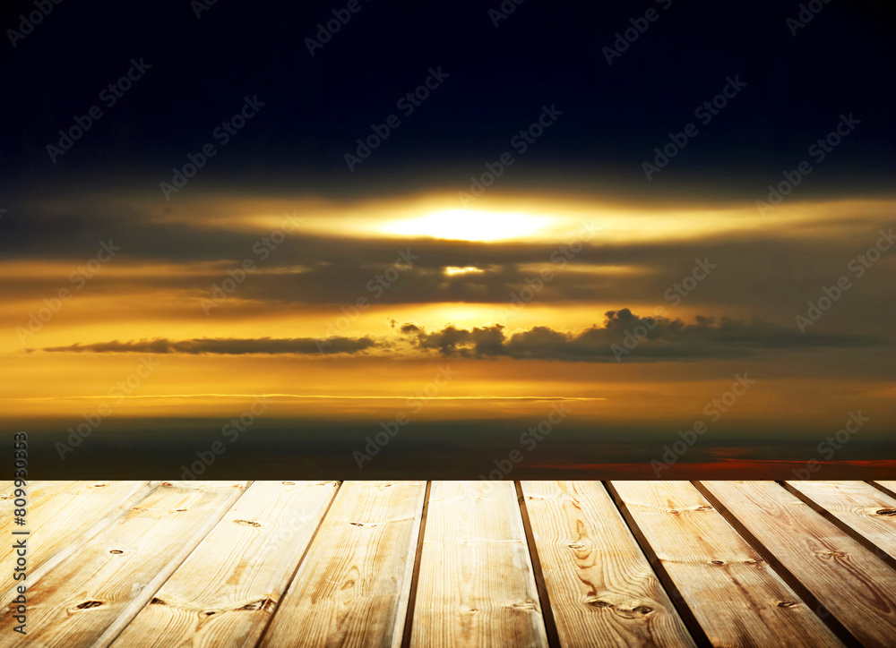 Wooden table on sky background and sunset light Wooden table on sky background and sunset light