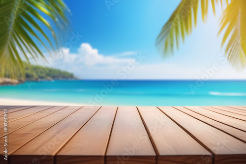Top of wood table with seascape and palm leaves, blur bokeh light of calm sea and sky at tropical beach background. Empty ready for your product display montage. summer vacation background concept.