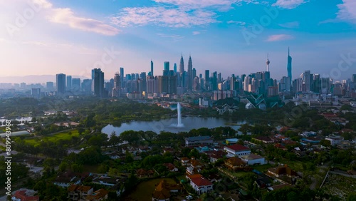 Aerial Hyperlapse of Kuala lumpur city with lake view overseeing Kuala lumpur city during sunrise