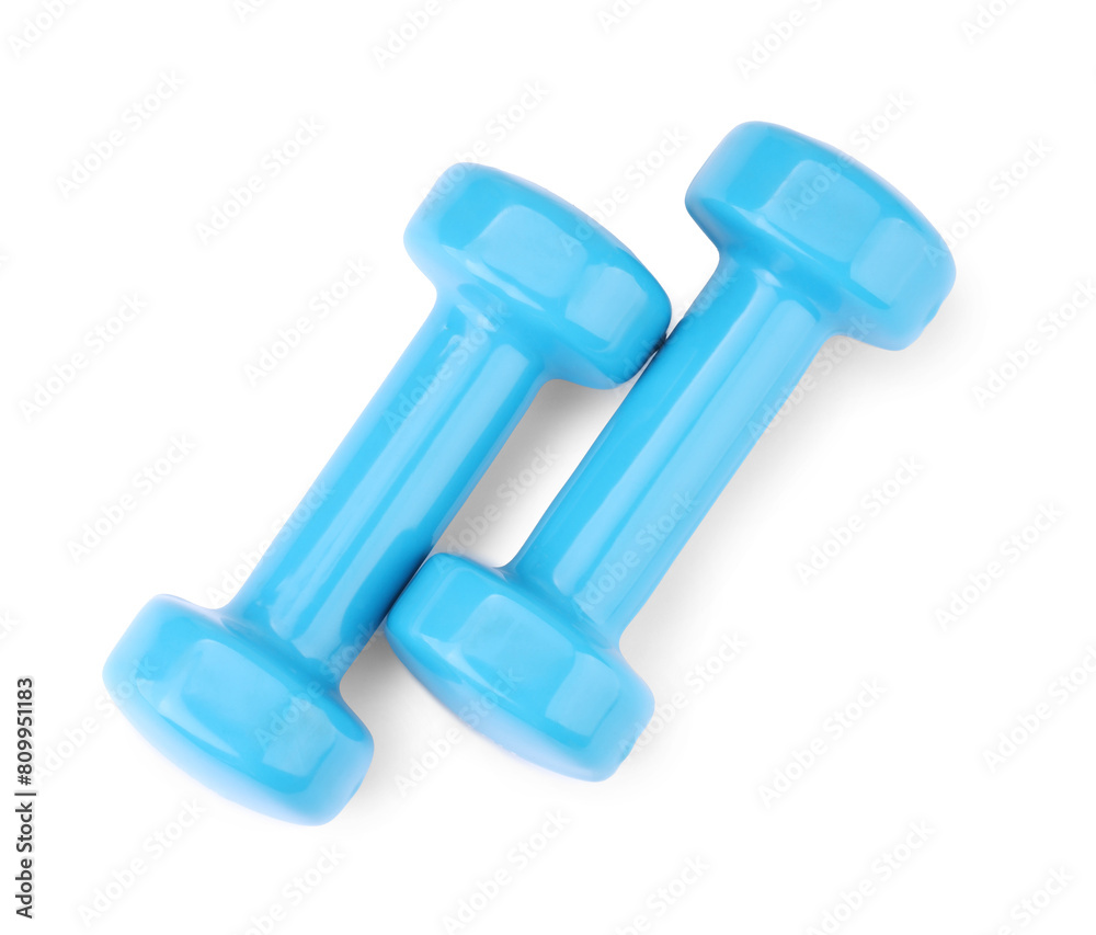 Light blue dumbbells isolated on white, top view. Sports equipment Light blue dumbbells isolated on white, top view. Sports equipment