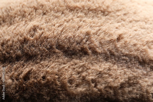 Texture of brown faux fur as background, closeup