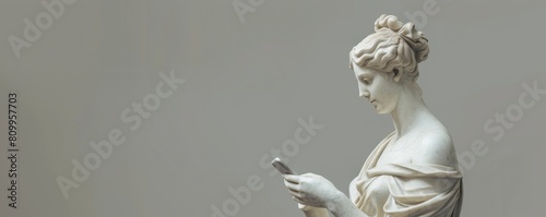 Ancient meets modern: statue with smartphone © Denys