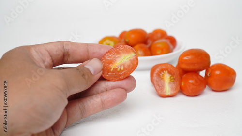 Red cherry tomatoes isolated on white background
