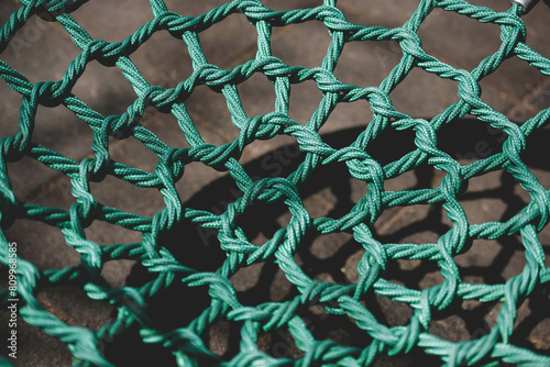 A net of green ropes