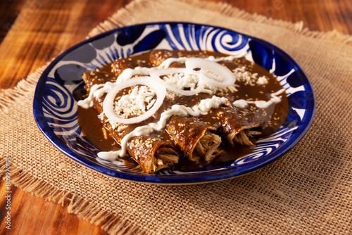 Chicken enmoladas. Also known as mole poblano enchiladas, they are a typical Mexican dish that is very popular in Mexico and the rest of the world.