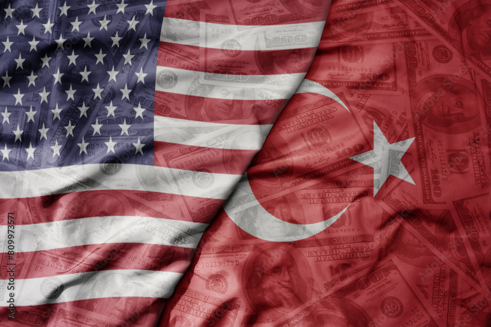big waving colorful flag of united states of america and national flag of turkey on the dollar money background. finance concept. big waving colorful flag of united states of america and national flag of turkey on the dollar money background. finance concept.