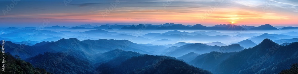 Ethereal Sunrise Over Mist Shrouded Mountains at Phu Chi Fa