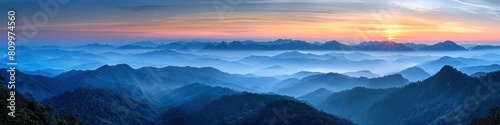 Ethereal Sunrise Over Mist Shrouded Mountains at Phu Chi Fa
