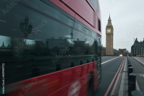 Red bus on Westminster Bridge and Big Ben clock tower. London, United Kingdom