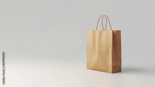 A simple brown paper bag placed on a white surface. Suitable for various projects and designs