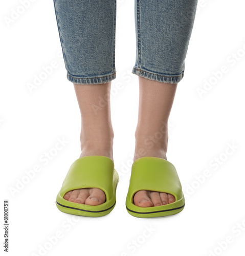 Woman in green slippers on white background  closeup