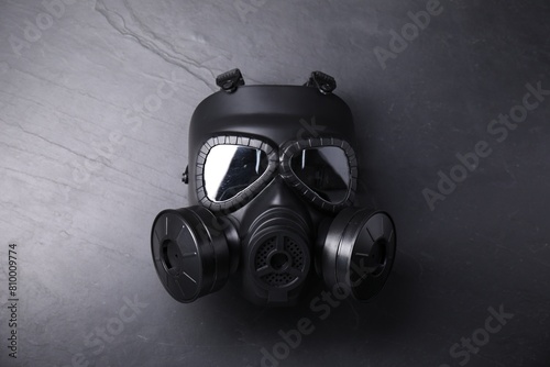 One gas mask on grey textured background, top view © New Africa
