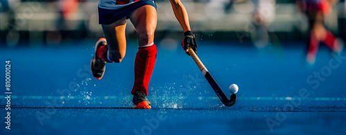 A female field hockey player controlling the ball