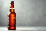 Bottle of beer with water drops on grey background,  Space for text
