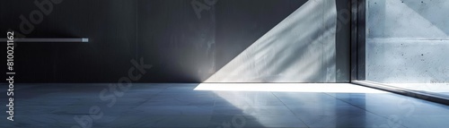 abstract minimalist art installation with light and shadow on a tiled floor against a black wall