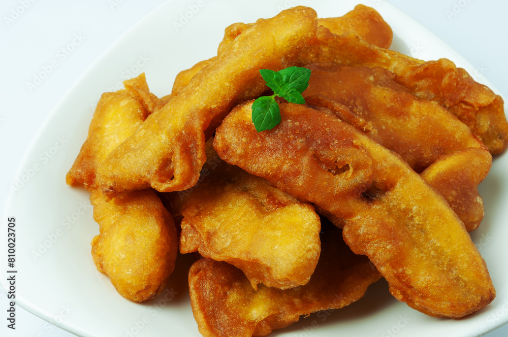 Pisang goreng or banana fritters on a plate Pisang goreng or banana fritters on a plate
