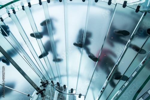People walking up transparent stairway, New York, USA