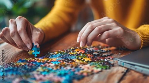 Female hands on a wooden office desk pick puzzle