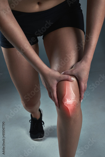 Studio, woman and legs with knee pain or hurt with inflammation from exercise and workout. Female person, muscle ache and injury from fitness, self care and wellness with wellbeing for health