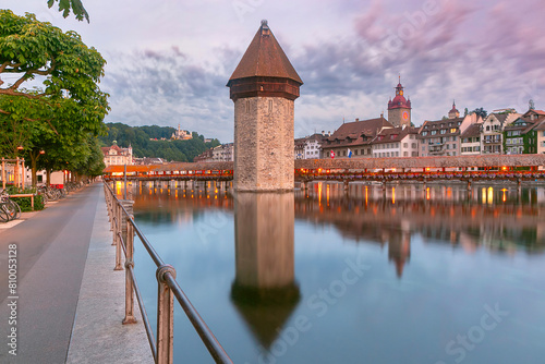 Twilight view of historic Chapel Bridge and Water Tower in Lucerne, Switzerland (ID: 810053128)