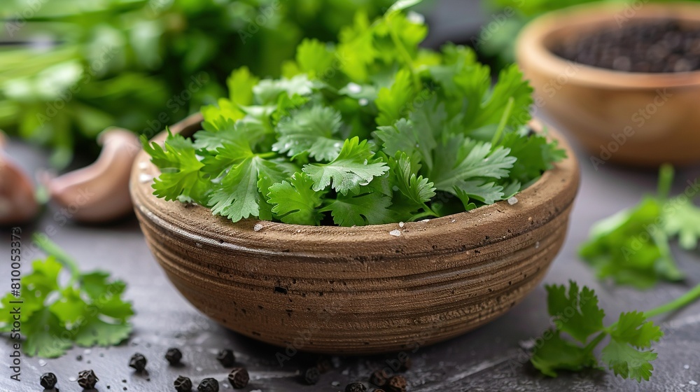 Wooden bowl holding green parsley accompanied by two smaller bowls filled with it Wooden bowl holding green parsley accompanied by two smaller bowls filled with it