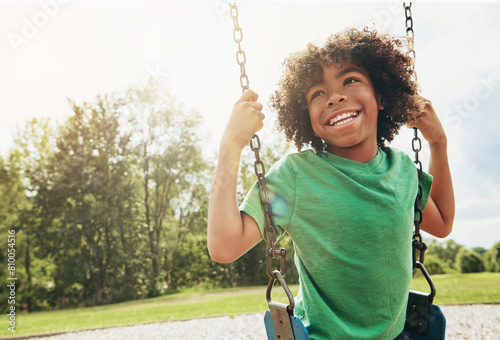 Billede på lærred Happy, nature and child on swing in park for fun, adventure and play time on holiday or weekend trip