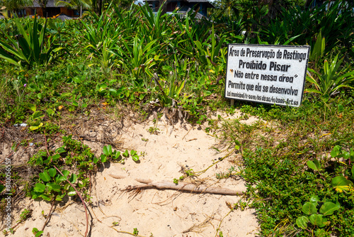 Sign indicating sandbank preservation area, warning approval to enter or be walked on. Araçatuba Beach, Arraial da Ajuda, BA, Brazil, Feb 2019 photo