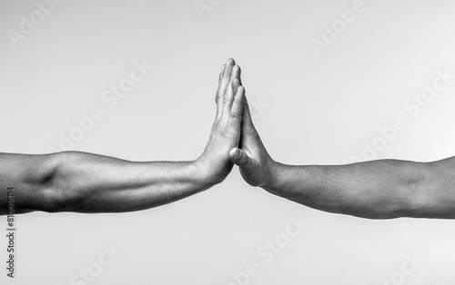 Men doing high five. Two hands gestures. Giving high five. Two hands, male and man. High five gesture of man and girl, successful cooperation. Black and white