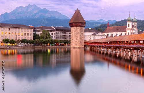 Twilight view of historic Chapel Bridge and Water Tower in Lucerne, Switzerland (ID: 810059380)