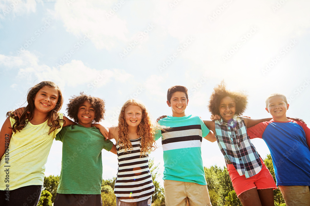 Children, friends and portrait as group in park with sunshine for school trip or bonding, diversity or together. Boys, girls and smile as youth community on nature camp with unity, support or kids Children, friends and portrait as group in park with sunshine for school trip or bonding, diversity or together. Boys, girls and smile as youth community on nature camp with unity, support or kids