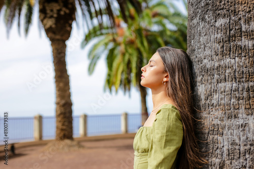 Young Hispanic Woman Breathing Fresh Air Outdoors