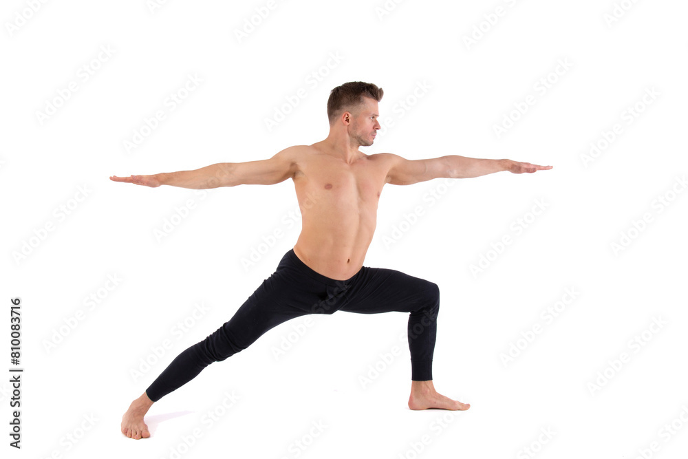 A young attractive man with an athletic body is doing yoga. White background.