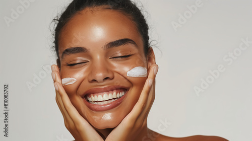 A stunning skincare influencer takes center stage, shooting captivating ads as she delicately applies cream to her radiant skin