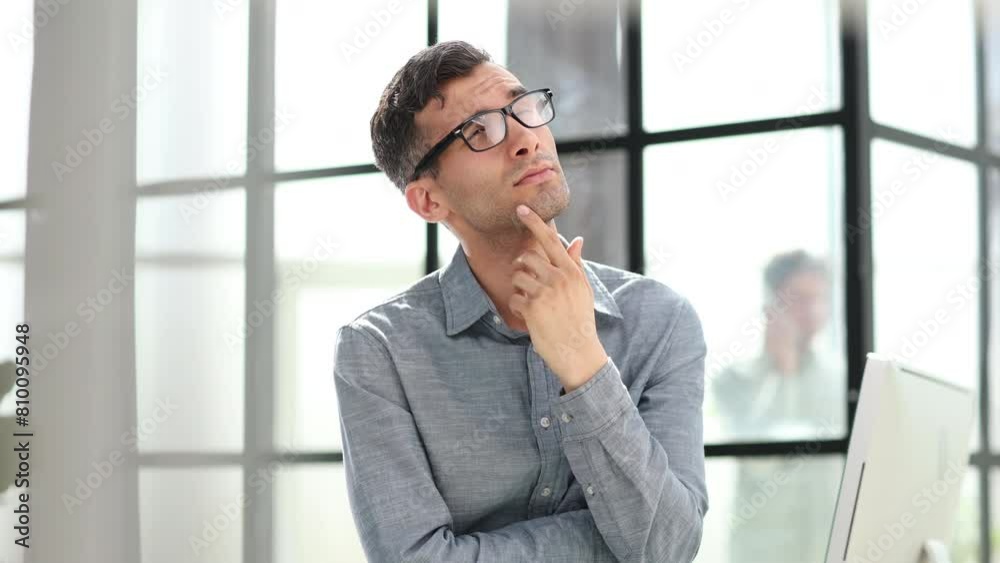Close-up portrait of a serious and thoughtful businessman in glasses Close-up portrait of a serious and thoughtful businessman in glasses