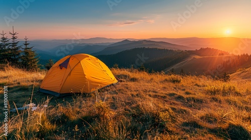  A yellow tent atop a verdant hillside, adjacent to a forest teeming with tall grass