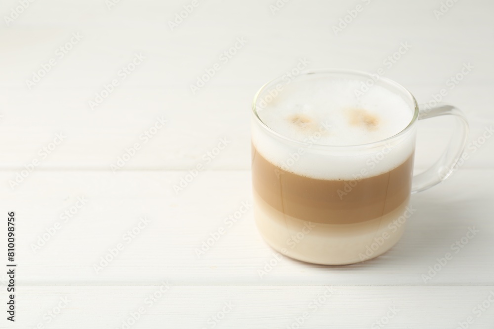 Aromatic coffee in glass cup on white wooden table, space for text Aromatic coffee in glass cup on white wooden table, space for text