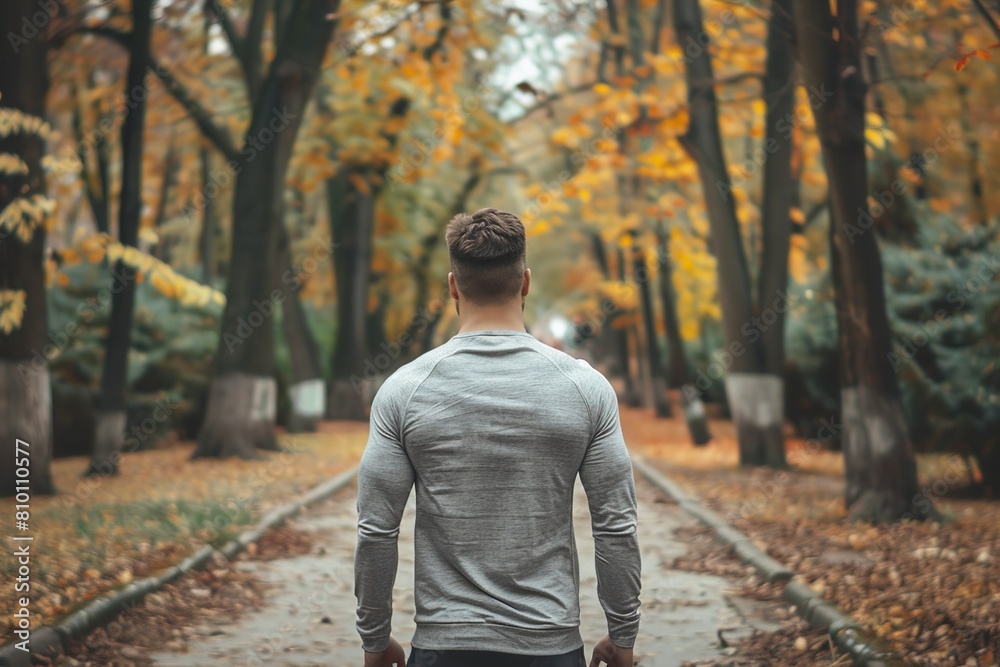 Full length rear view of fit man standing on path Full length rear view of fit man standing on path