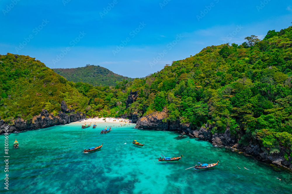 Concept Travel Thailand, aerial view paradise turquoise lagoon with white sand. Phi Phi Don island, Nui beach Concept Travel Thailand, aerial view paradise turquoise lagoon with white sand. Phi Phi Don island, Nui beach