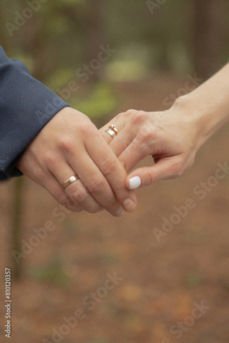 bride and groom holding hands © Julia Aleksandrova