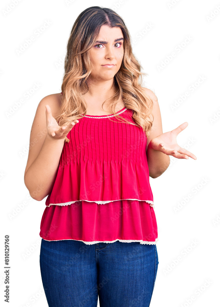 Young caucasian woman wearing casual clothes clueless and confused expression with arms and hands raised. doubt concept. Young caucasian woman wearing casual clothes clueless and confused expression with arms and hands raised. doubt concept.
