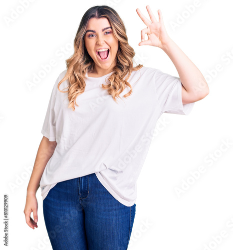 Young caucasian woman wearing casual clothes smiling positive doing ok sign with hand and fingers. successful expression.