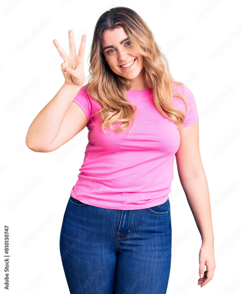 Young caucasian woman wearing sportswear showing and pointing up with fingers number three while smiling confident and happy. Young caucasian woman wearing sportswear showing and pointing up with fingers number three while smiling confident and happy.