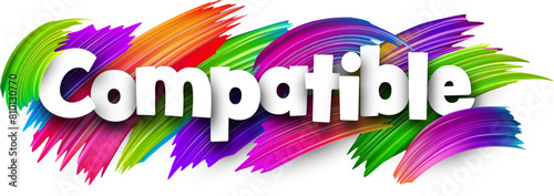 Compatible paper word sign with colorful spectrum paint brush strokes over white.