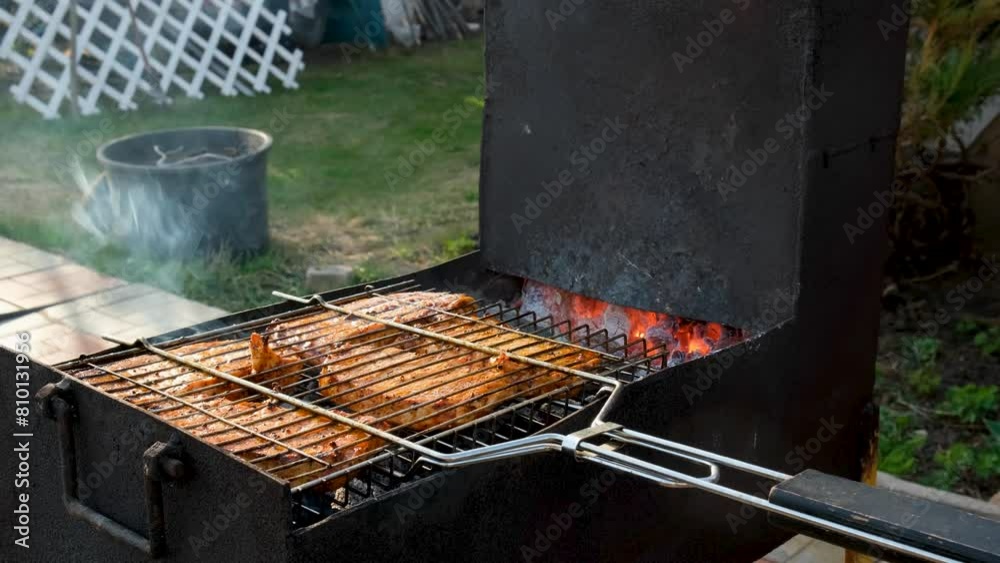 Grilled pieces of meat on coals are fried outside. Grilled pieces of meat on coals are fried outside.