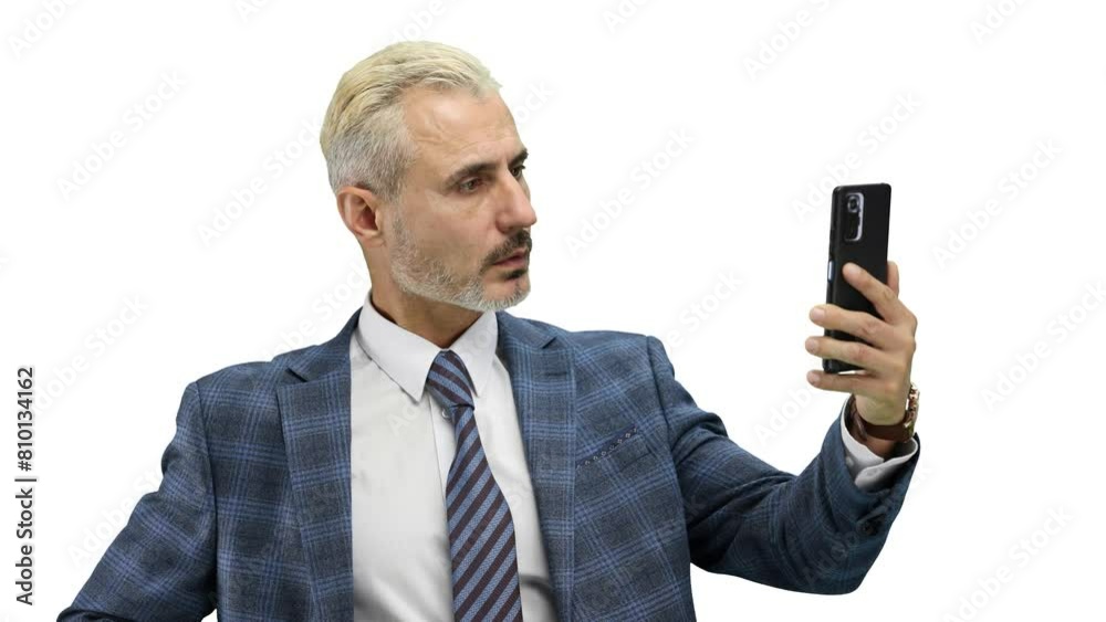 Man, close-up, on a white background, talking on the phone Man, close-up, on a white background, talking on the phone
