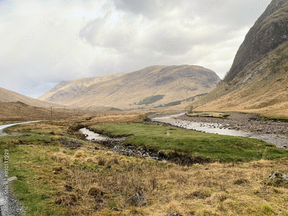 A view of the Scotland Countryside near the Glencoe Mountains on a sunny day